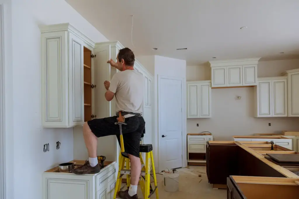 Prepare for Your Design Appointment, Man Installing Kitchen Cabinets Door 